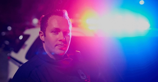 police officer in front of lights