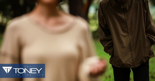 woman walking and man following behind her