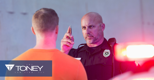 police conducting field sobriety test with pen